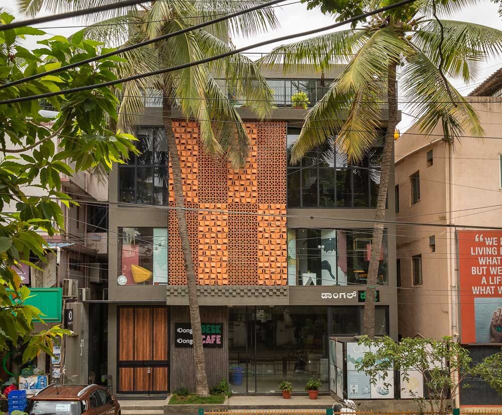 The Dongle & Co building on 100 Feet Road, Indiranagar, with its perforated brick facade