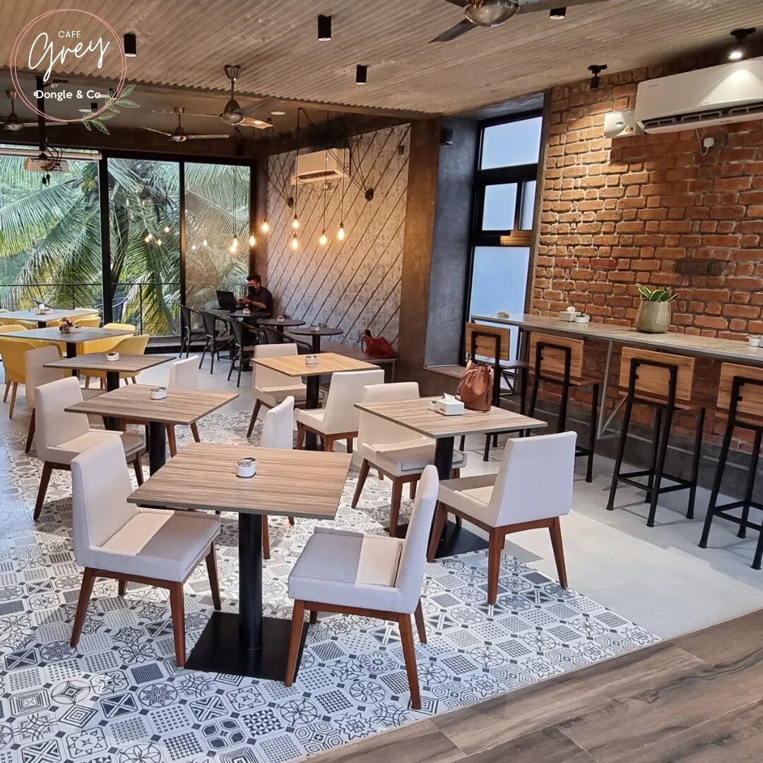Cafe Grey interior with brick walls and communal tables
