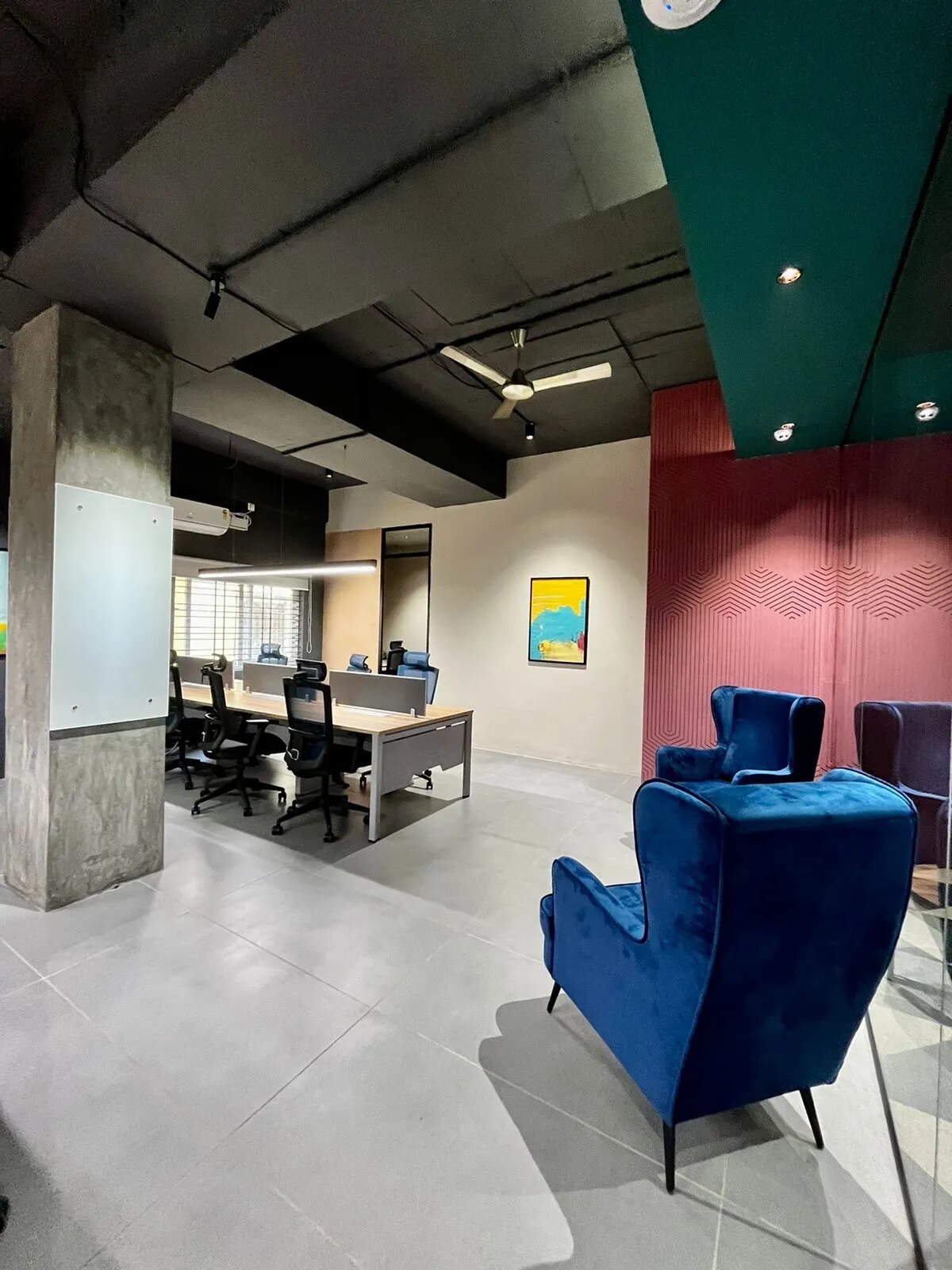 A private office floor with desks and ergonomic chairs